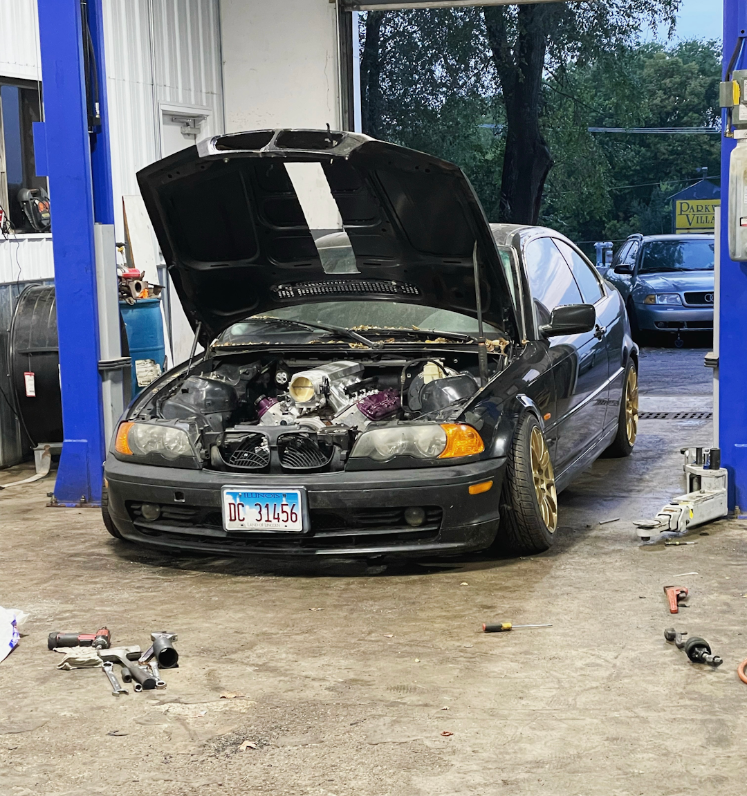Midwest Mechanix Auto Repair Shop Working in Shop